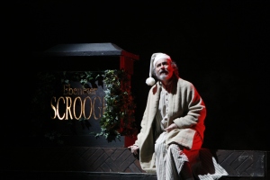 Gregor Paslawsky plays Ebenezer ScroogeHis tombstone is a prop as is the moving ivy that dresses it. 